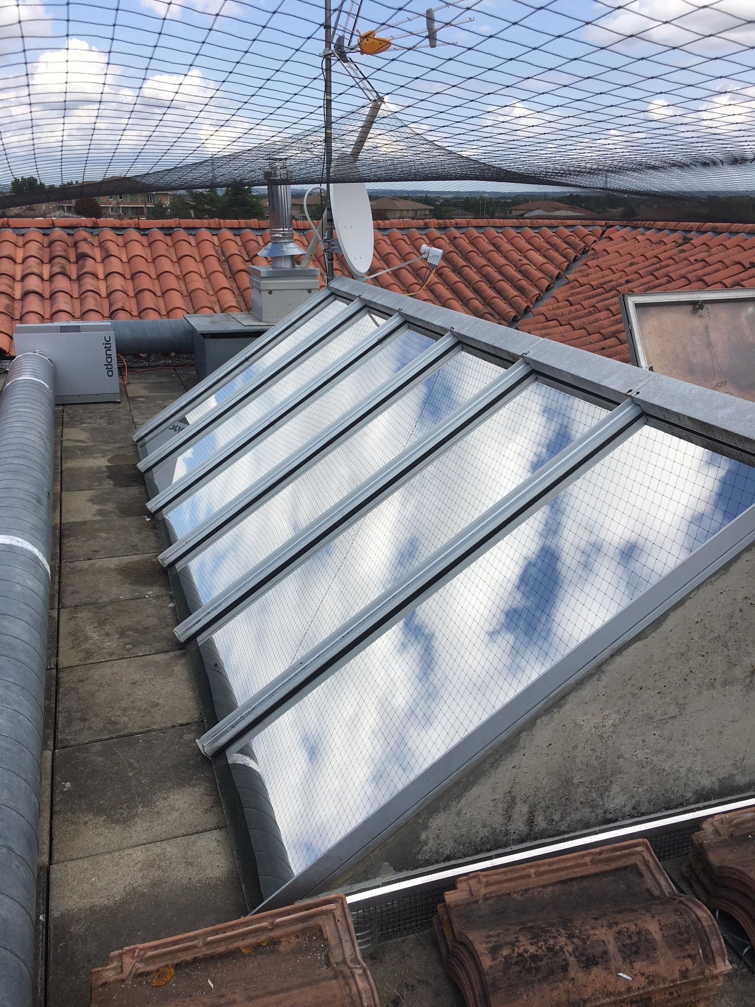 Immeuble toit verrière Plastimage toulouse film solaire effet miroir